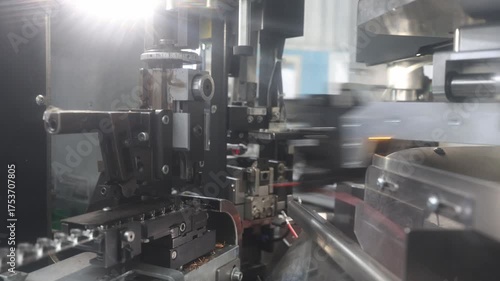 electric harness automotive factory, machinery, people, connectors and wires in the manufacturing process