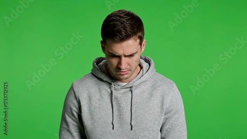Upset Young Man Feeling Sad and Disappointed on Green Screen.
