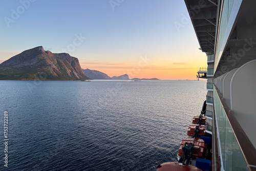 View from the balcony of a cruise ship at sunset in a fjord in Norway