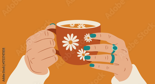 Hands holding flower tea cup in warm colors for autumn lifestyle visuals