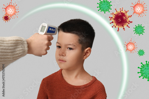 Mother measuring her ill li...