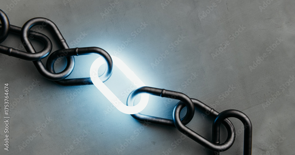 © AddMeshCube - A single illuminated link shining in a dark metal chain on a concrete background, a symbol of power and connection.3d rendering