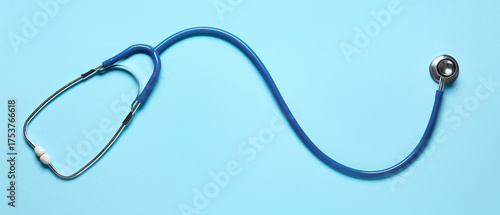 Modern stethoscope on color...