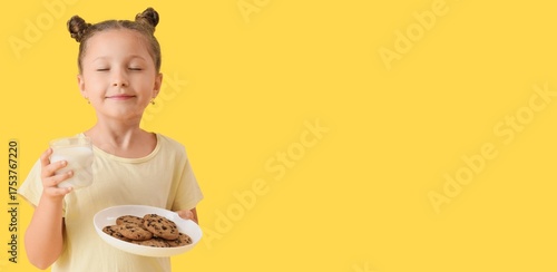 Happy little girl holding g...