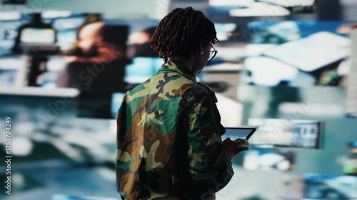 Wallpaper Mural Intelligence agency professional scanning enemy rockets using tablet app. Military operator using radar systems on device to detect incoming ballistic missiles, serving country, camera B Torontodigital.ca