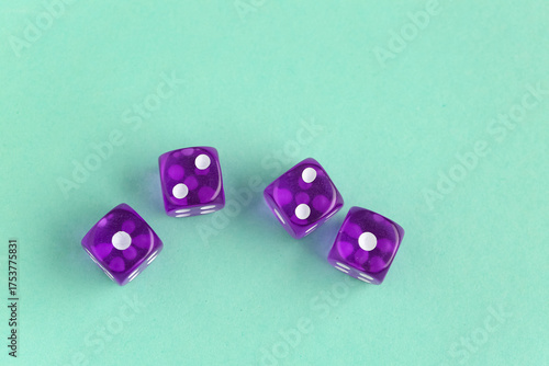 Four purple translucent dic...