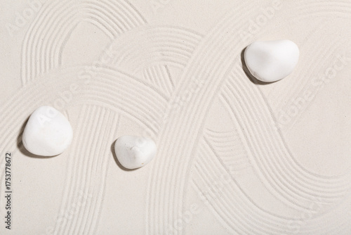 Canvas Print Spa stones on light sand. Zen concept