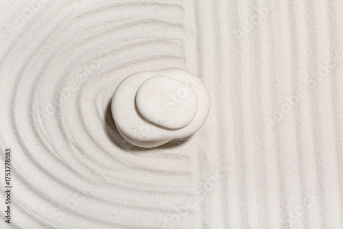 Canvas Print Spa stones on light sand with lines. Zen concept