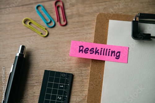 There is sticky note with the word Reskilling. It is as an eye-catching image.