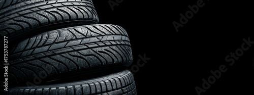 Car tires on black background with copy space. Seasonal replacement of tires. Car care concert