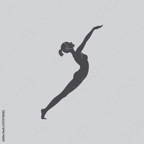 Silhouette of a woman in a dynamic graceful pose against a gray background