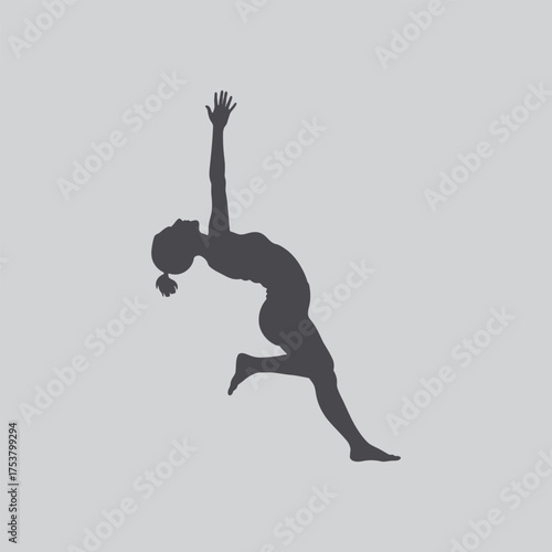 Silhouette of a person gracefully bending backwards in a dynamic pose