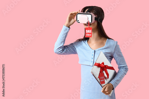 Young woman in VR glasses w...