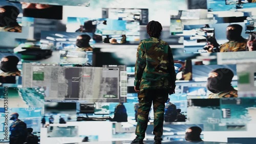 Wallpaper Mural Military officer oversees mission control on digital display showing intelligence feeds. Soldier stands in front of command screens used for surveillance and threat monitoring, camera A Torontodigital.ca