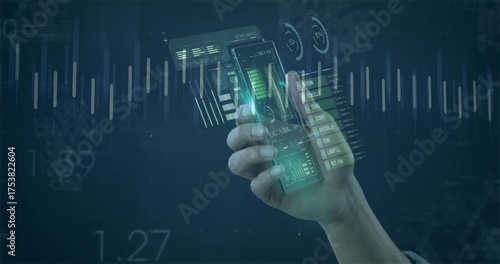 Gripping smartphone projecting translucent holographic panels in AR workspace, data visualization
