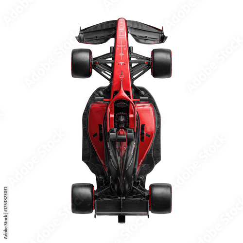 Top-down view of a racing car, predominantly red and black, with large, dark wheels.  Aerodynamic design, complex chassis, and visible engine components