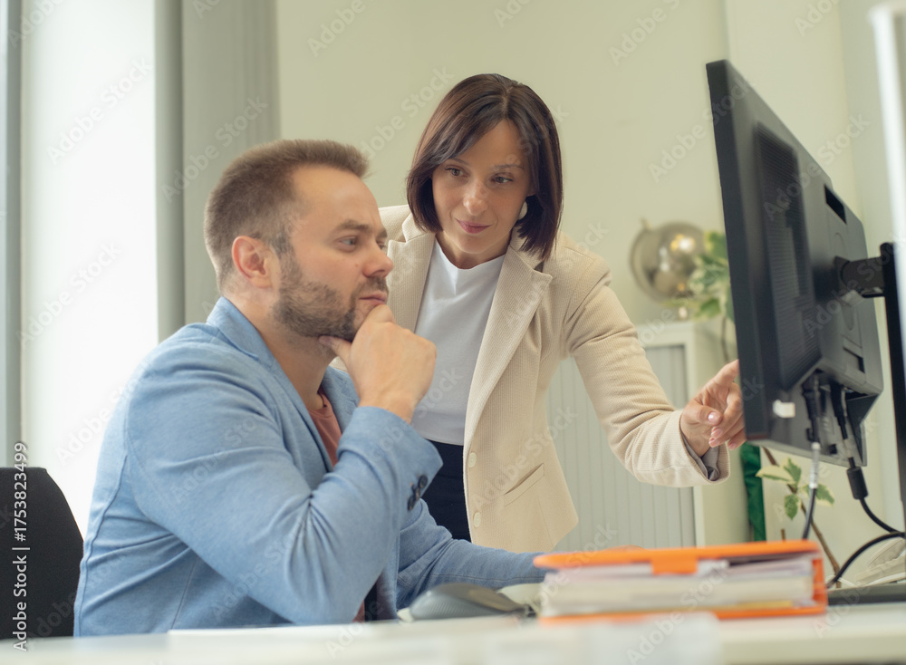 Fototapeta premium colleagues in the office are planning, deciding, and consulting