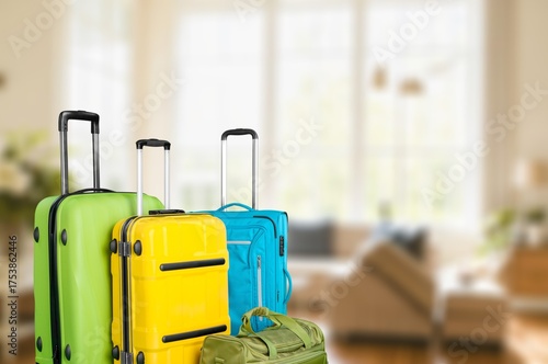 Suitcases with set travel accessories in room