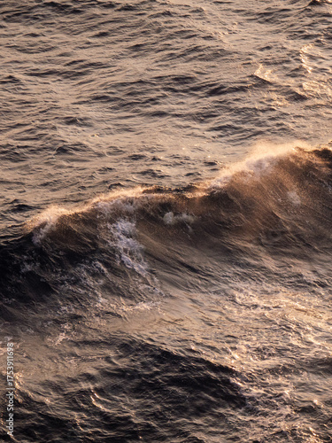 Blue and white open sea waves. Suitable for background or wallpaper. Vertical photo.