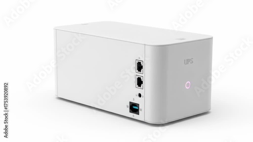 A white rectangular device with ports on one side, a glowing light indicator, and the letters 