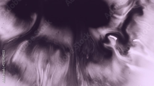 Paint flow. Pour liquid. Defocused purple white color chemical emulsion water texture blotch spreading on creative abstract background.