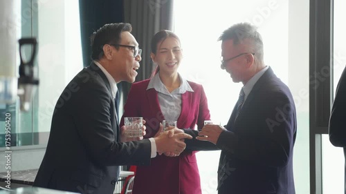 Successful asian businessman handshake with partnership during corporate meeting for celebrating, partnership for agreement and contract with marketing, group team business people and success.