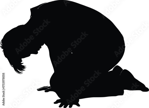 Black Silhouette of a Person Kneeling with Head Bowed in Sadness or Reflection