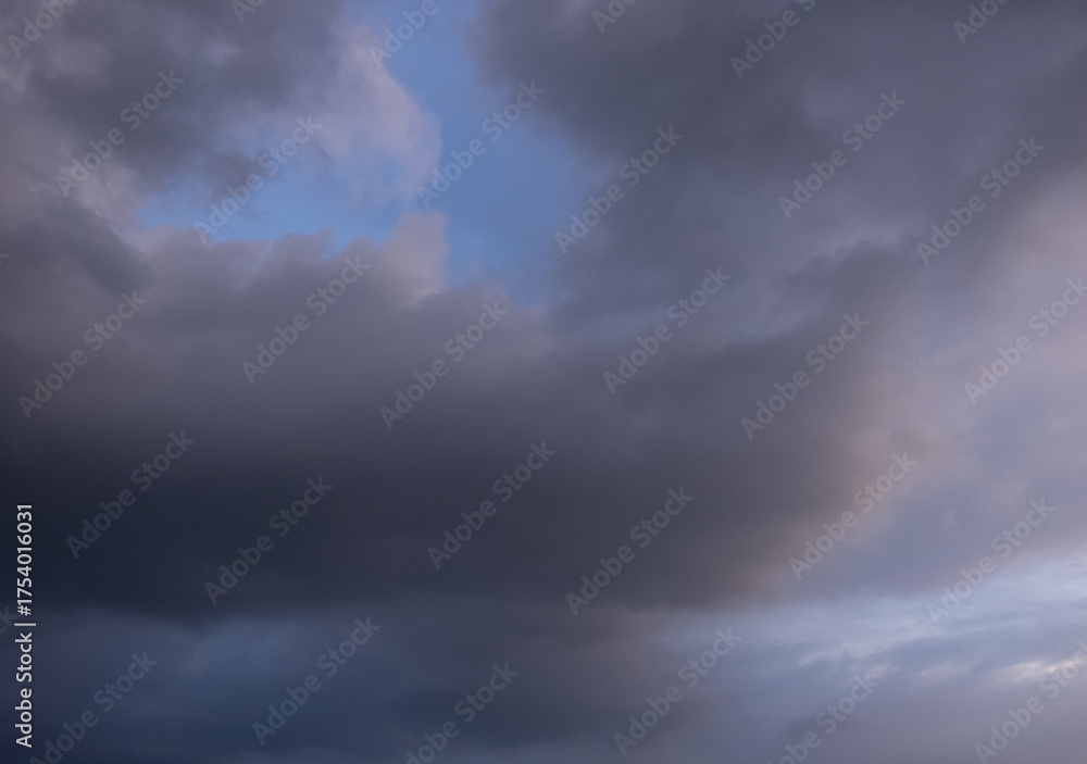 Fototapeta premium Dark sky with stormy clouds. Dramatic sky rain,Dark clouds before a thunder-storm,clouds before rain