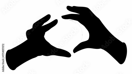 Silhouette of two hands creating a heart shape around a glowing orb against a white background image view