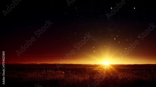 Expansive landscape during sunrise or sunset with golden light reflecting on tall grasses,