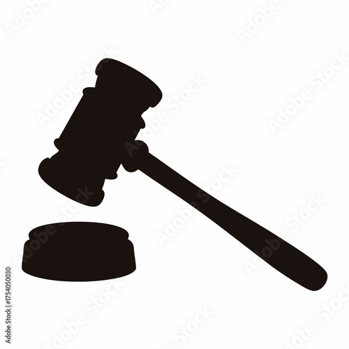 Silhouette of a judge's gavel ready to strike the sounding block