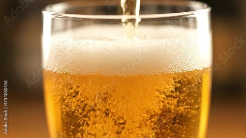 Wallpaper Mural Golden Liquid Pouring into Glass Tumbler Creating White Foam with Bubbles on Wooden Table in Soft Lighting Torontodigital.ca