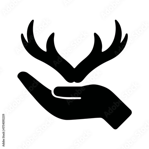 Human hand holding deer antlers silhouette. Wildlife protection and nature conservation concept. Forest animal symbol icon.