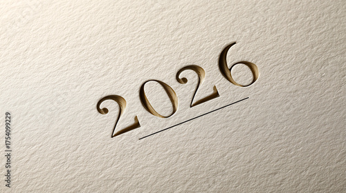 Luxurious 2026 title engraved or embossed on high-quality, textured cream paper with a subtle underline. Elegant concept for New Year's greetings, high-end invitations, calendar design