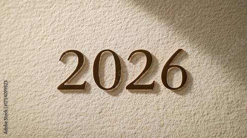 2026 New Year Goals and Future Planning Concept. Minimalist typography for the year 2026 in a thin, modern font on a soft cream paper texture background