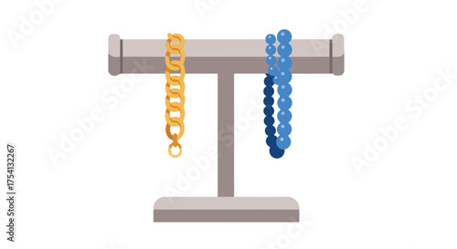 Elegant jewelry display featuring a golden chain and a blue beaded necklace on a gray stand presenting luxurious accessories for adornment and style