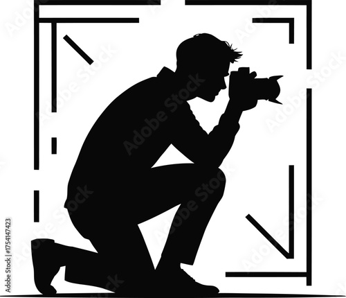 Kneeling photographer capturing a moment through a viewfinder silhouette