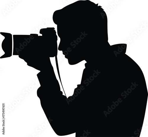 Man photographer holding camera focused on subject silhouette