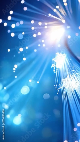 Glowing strands with bright bokeh, on a blue backdrop
