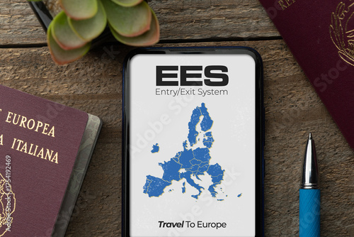 EES entry exit system concept: two passports on a wooden table