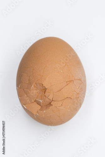 one broken egg in close-up on a light background