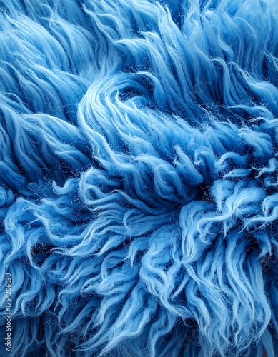 Abstract, close-up view of soft, fluffy texture in varying shades of blue, creating a swirling effect