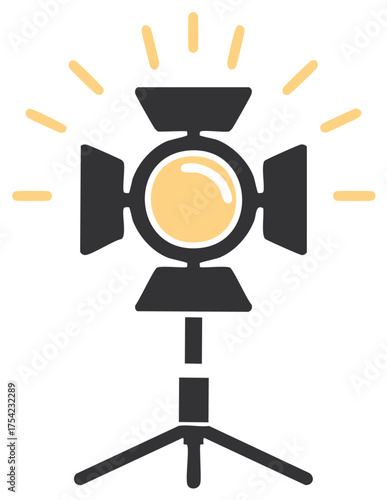Shining professional studio spotlight on a tripod stand vector icon