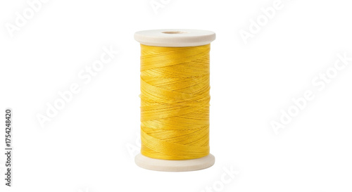 Isolated spool of yellow thread for sewing or embroidery and crafting needs, clean background