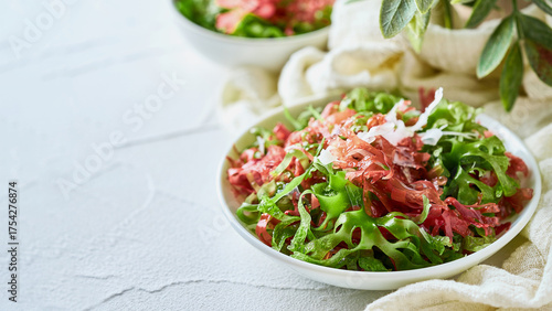 closeup mix kaiso seaweed salad green red white algae kelp in bowl on bright food background with copy space