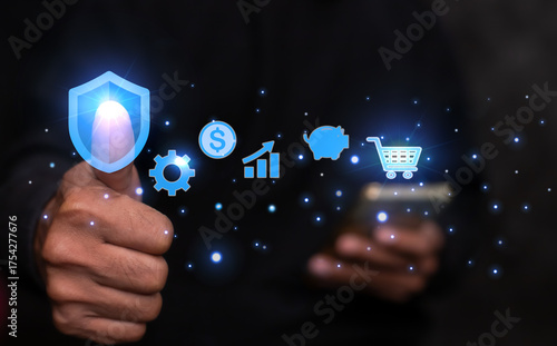 Technology online shopping business concept. man's hand touching to virtual info graphics with trolley cart icons.