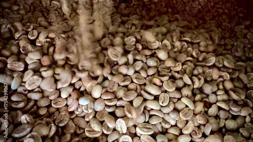 Detailed macro shot of raw dried coffee beans showing natural textures and earthy tones, ideal for backgrounds, agriculture, or coffee industry concepts.