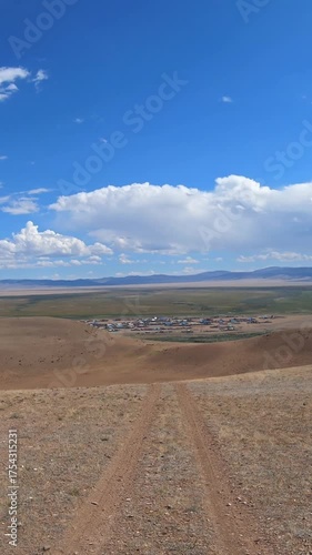Driving along a country road in Altai desert and semi-desert environment.