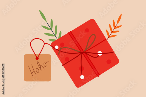 Red gift box with hoho tag and leaf decor