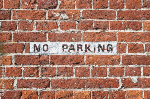 Wallpaper Mural Hand painted No Parking sign seen on an old brick wall at a London design studio. The wall dates back to Victorian times. Torontodigital.ca